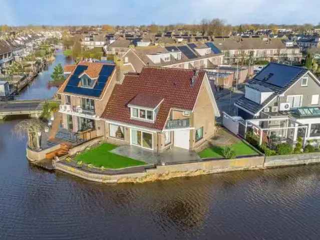 Halfvrijstaand huis Volendam - Uitzicht over water en weilanden