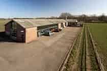Bedrijfsruimte met woning te koop in Baexem