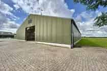 Bedrijfsruimte IJzendijke 1309m2  Loods Schuur Woning Zwembad