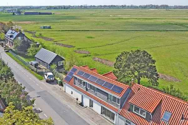 Unieke Dijkwoning met 915m2 Eigen Grond en Prachtig Uitzicht