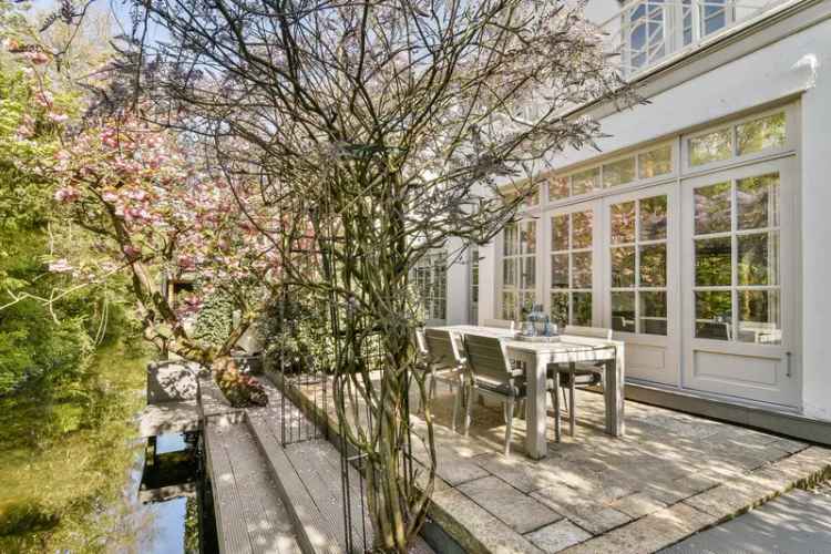 Huis te koop Hillegersberg: gerenoveerd vrijstaand huis met 4 slaapkamers en tuin aan het water