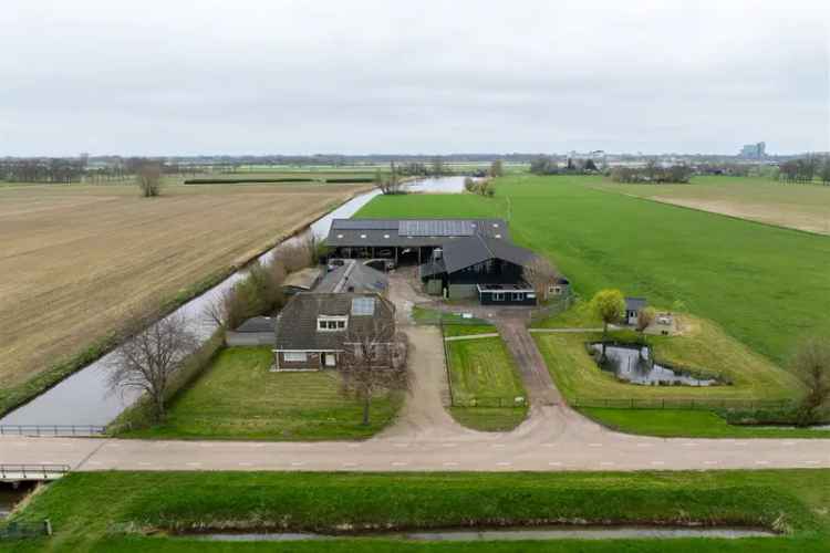 Bedrijfshal Hattem te koop: bedrijfswoning met 2000m2 bedrijfsruimte en agrarische grond