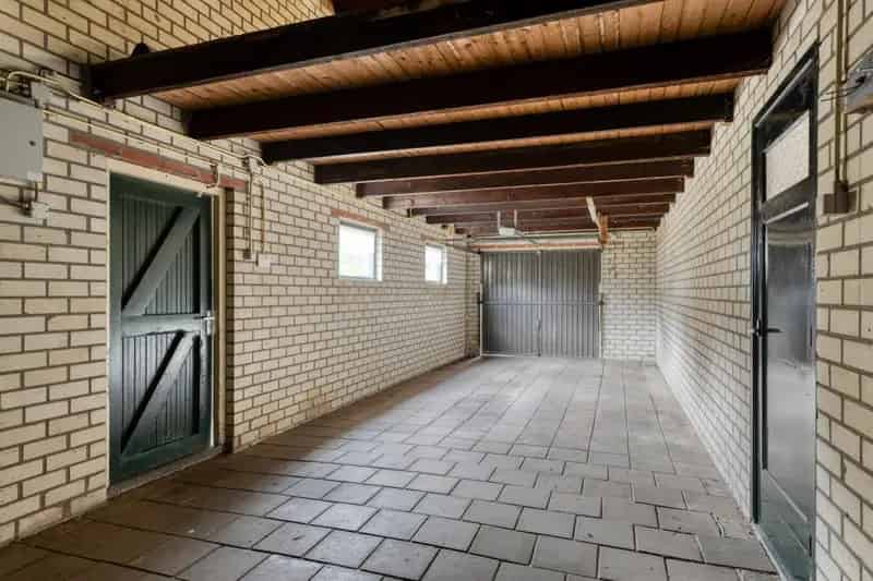 Vrijstaande woning met bedrijfshal te Mierlo