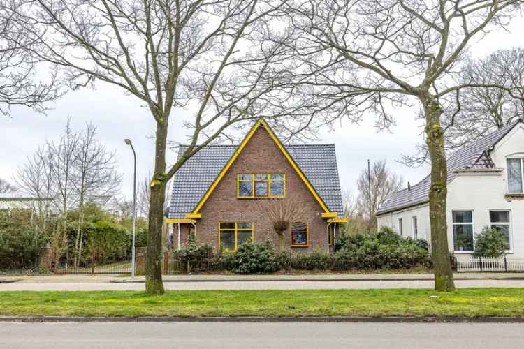 Bedrijfshal met vrijstaande woning en groot perceel in Sappemeer