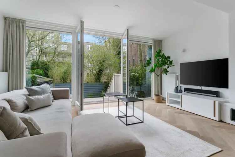 Amsterdamse benedenwoning met tuin en sauna te koop