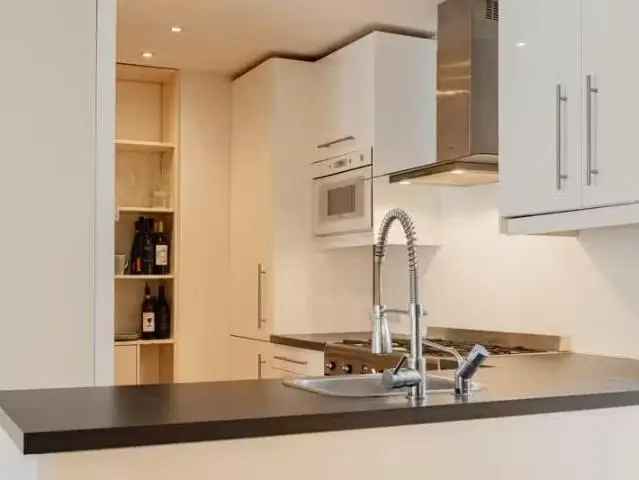 Sfeervol dubbel benedenhuis Oud-West 58m²