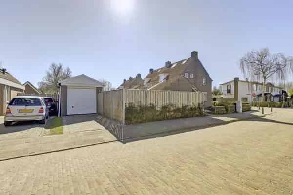 2-onder-1-kapwoning Kortgene: Ruime Tuin Garage Starterswoning
