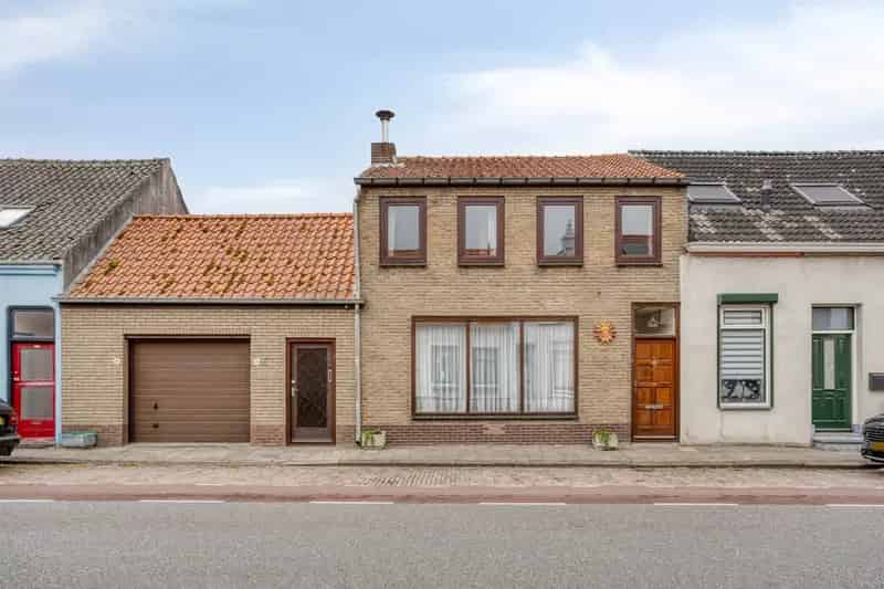 Ruime Tussenwoning Zuidzande 4 slaapkamers Grote Garage Nieuwe Daken