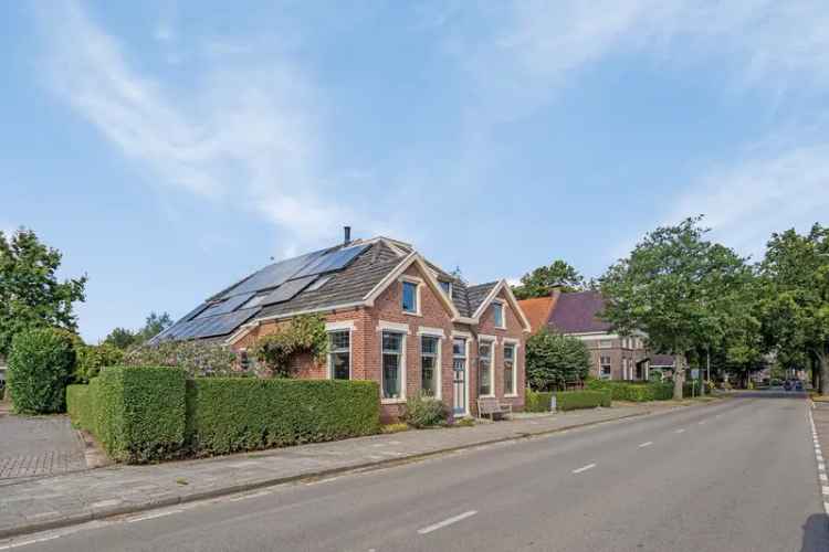 Vrijstaand woonhuis met werkruimte en tuin - Energielabel A