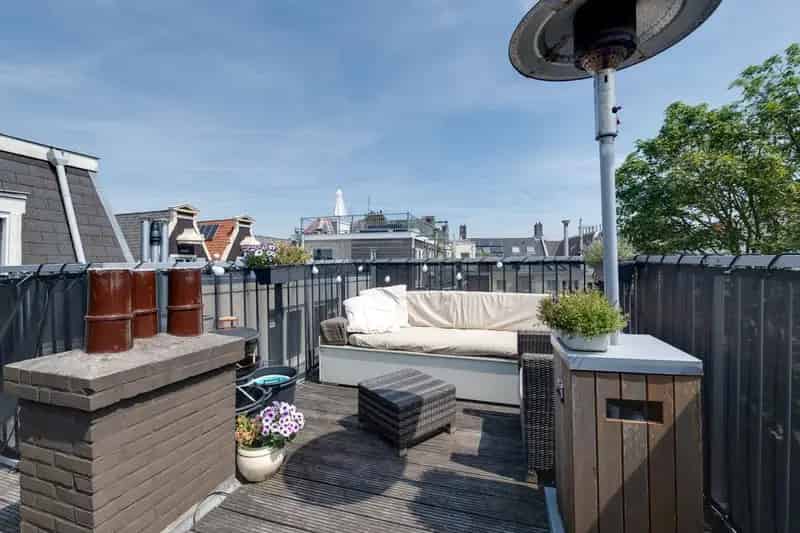 Amsterdam Centrum: Sfeervol Dubbel Bovenhuis met Dakterras