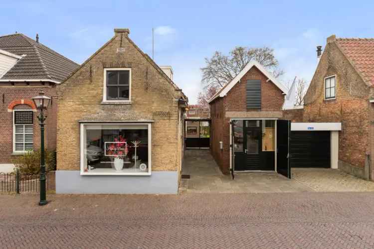 Vrijstaande woning met winkel Poortugaal 575m2