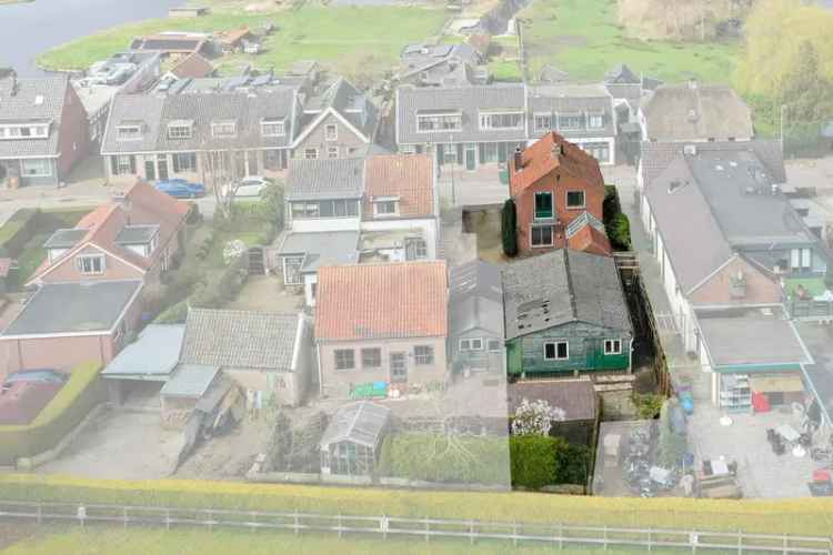 Vrijstaande woning met bedrijfsruimte Ankeveen