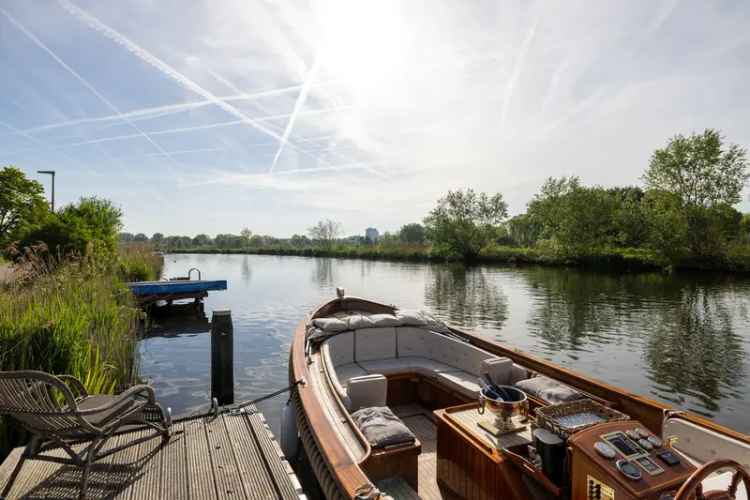 Huis te koop Rottekade: Luxe dijkwoning met studio en sauna