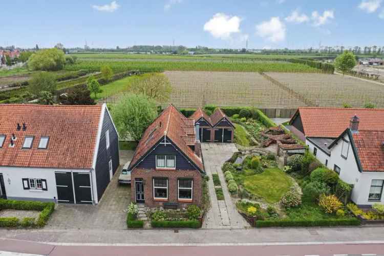 Vrijstaande woning met werkplaats en garage Kapelle