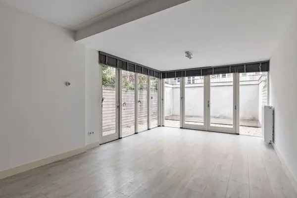 Ruim 3-kamerappartement begane grond met tuin en 2 badkamers