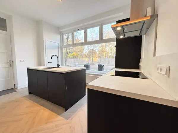 2-kamer appartement begane grond tuin ruime kelder modern