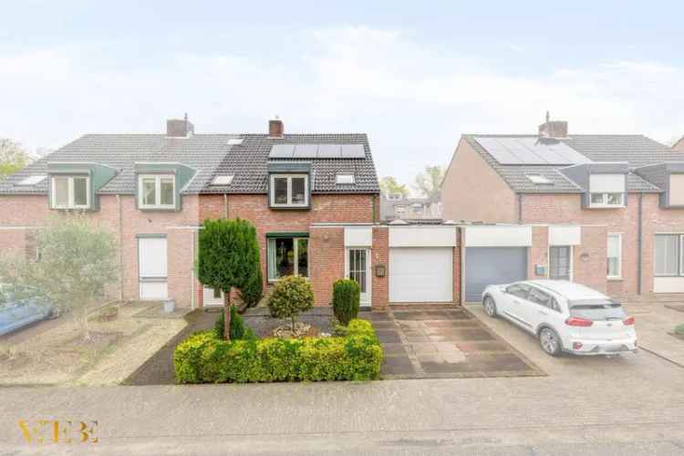 2-onder-1-kapwoning met uitbouw garage en 8 zonnepanelen