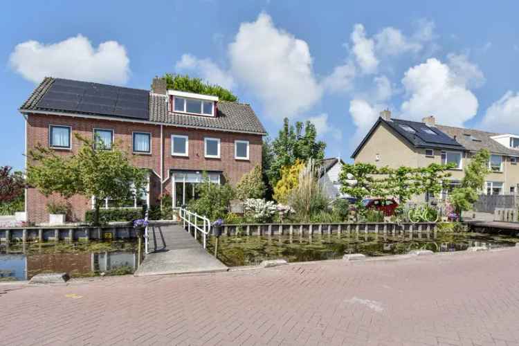 Landelijk gelegen 5-kamer woning met diepe tuin en souterrain