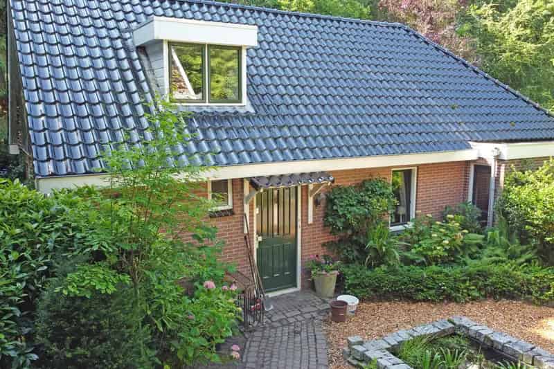 Vrijstaand huis Twijzelerheide: Ruime woning met gastenverblijven en parktuin