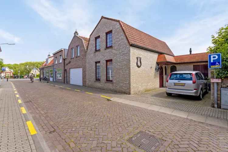 Rolstoelvriendelijke woning te Sluis met 4 slaapkamers en molenzicht