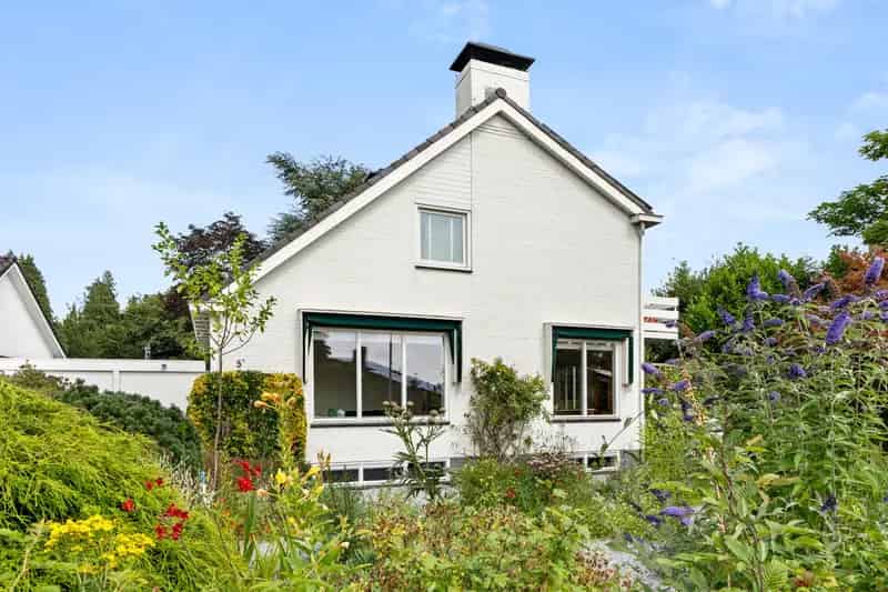 Vrijstaande woning Renkum: Ruime gezinswoning met garage en tuin