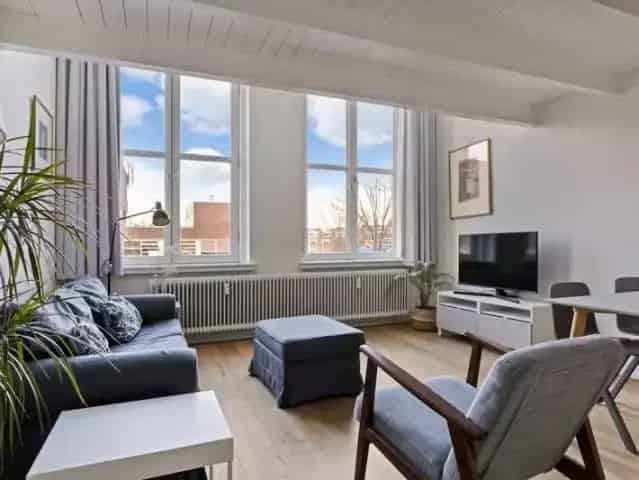 Amsterdam Centrum: Sfeervol Tweekamerappartement met Dakterras