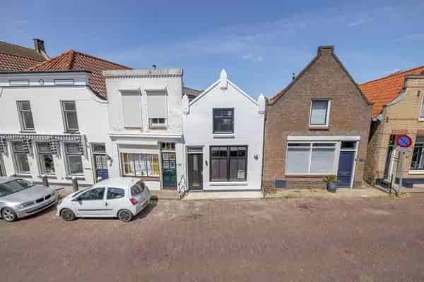 Tussenwoning Haringvliet: Knusse woning met diepe tuin