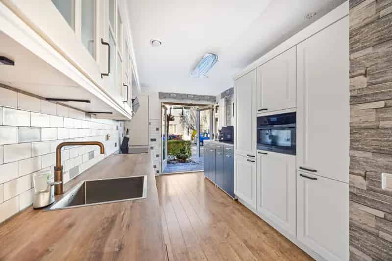 Tussenwoning 4 slaapkamers Diepe tuin Moderne keuken 15 zonnepanelen