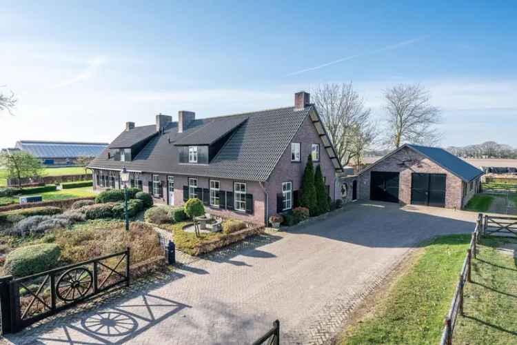 Vrijstaande woning met bedrijfsgebouwen te Someren