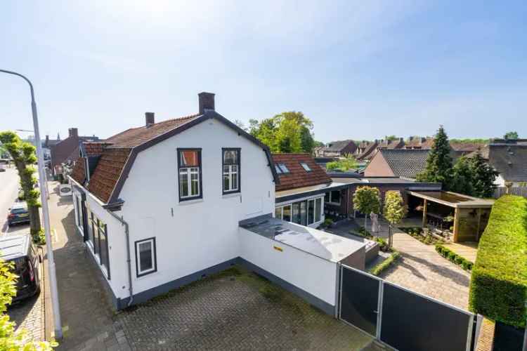 Vrijstaande woning met winkel Vlijmen