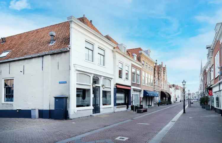 Rijksmonument Brielle: Winkel, 3 Studio's en Garages
