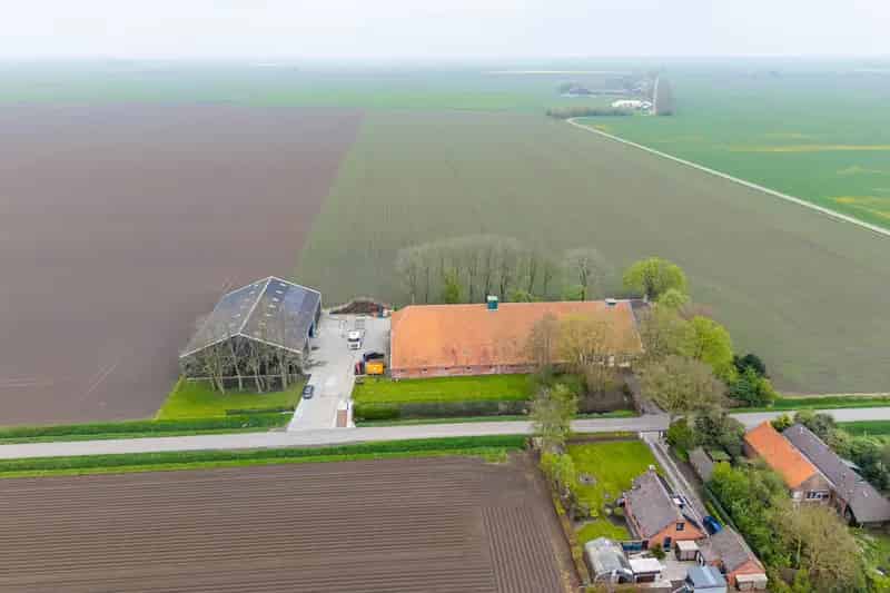 Bedrijfshal Nieuwolda te koop: Boerderij met loods en woning