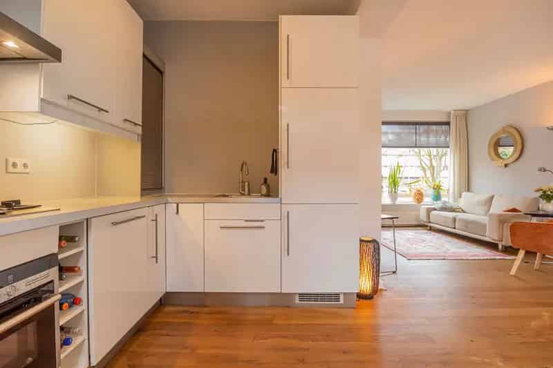 Huis te koop Ede: Ruime tussenwoning met uitbouw en tuin