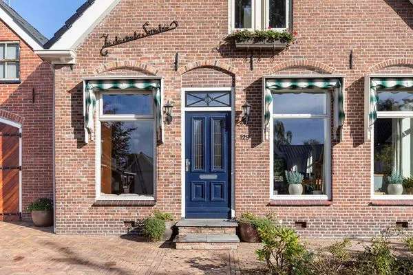 Historische woning met 4 slaapkamers en ruime tuin in Opende