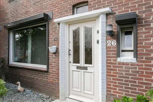 Twee onder een kapwoning te koop in Brunssum met garage en tuin